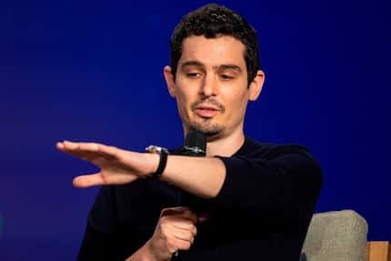 Director Damien Chazelle speaks during a press conference for 'First Man' at the Toronto...