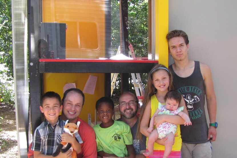 
Matt Lain and Jeff Fraley of Irving with their foster children won a Dallas CASA playhouse.
