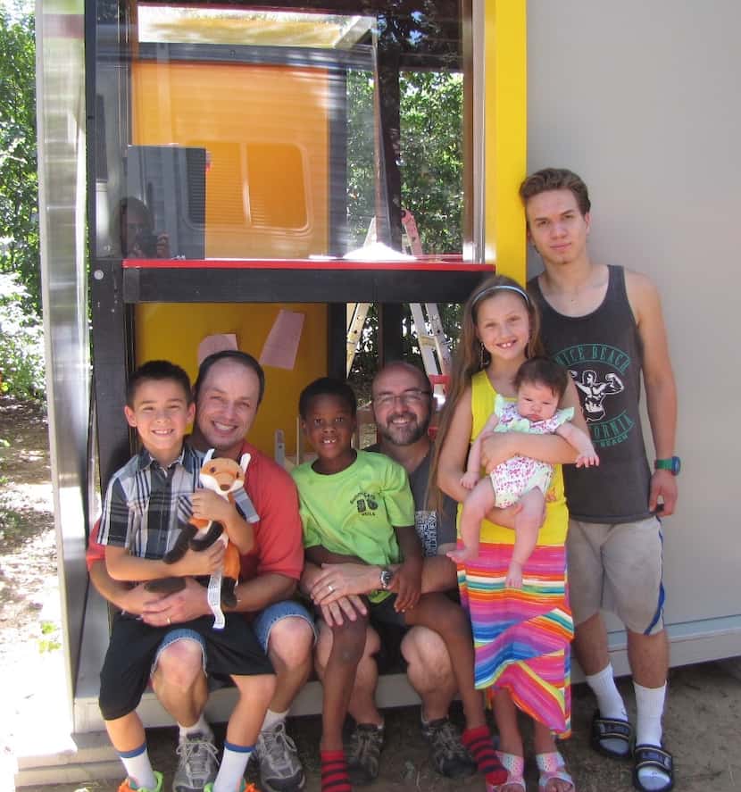 
Matt Lain and Jeff Fraley of Irving with their foster children won a Dallas CASA playhouse.
