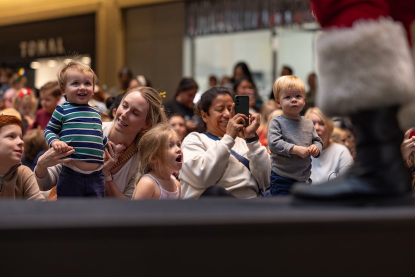 Crowds gather to see Joel Lagrone perform as Santa at NorthPark Center on Dec. 3, 2024. 