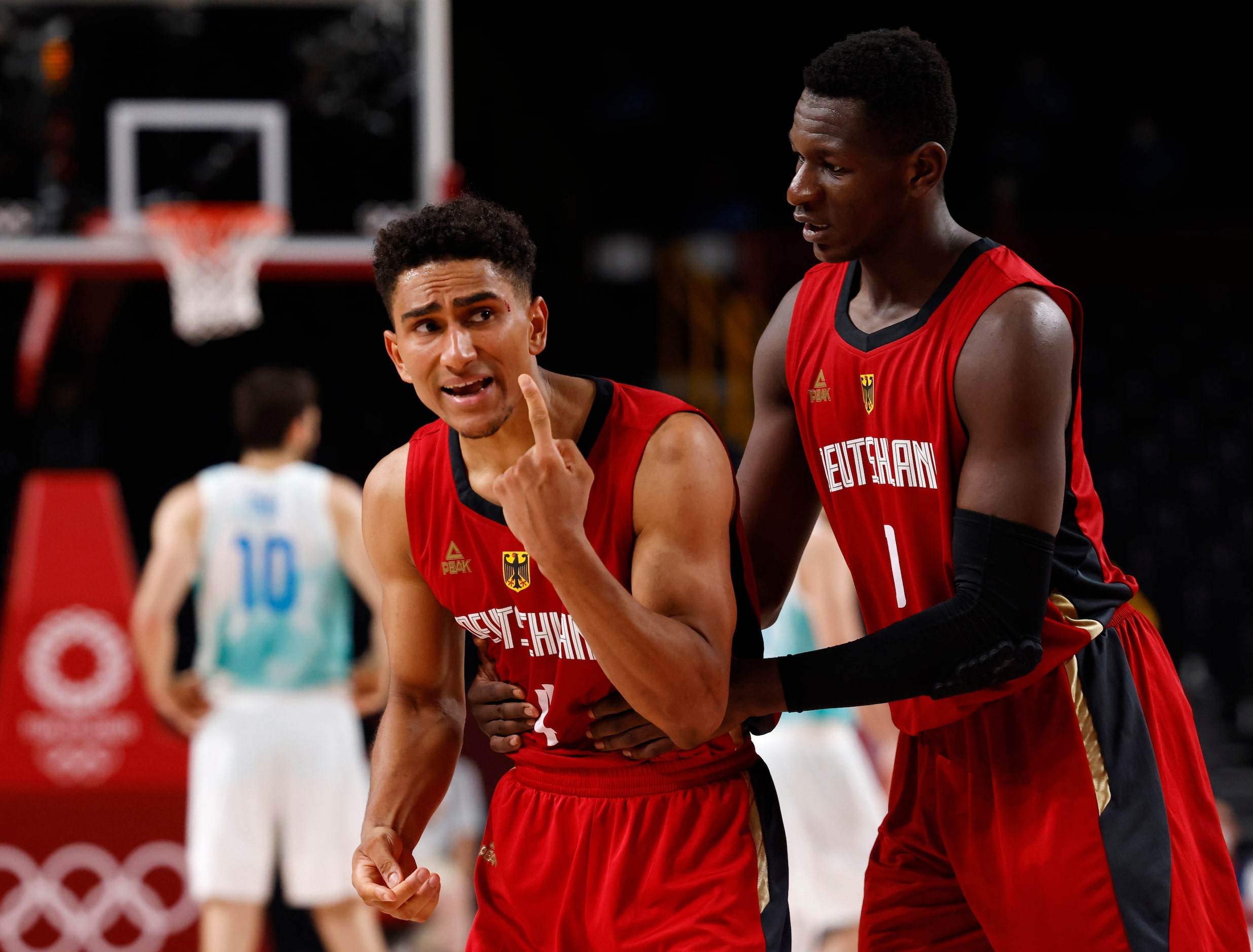 Germany’s Maodo Lo (4) complains to an official after getting hit in the head in a game...