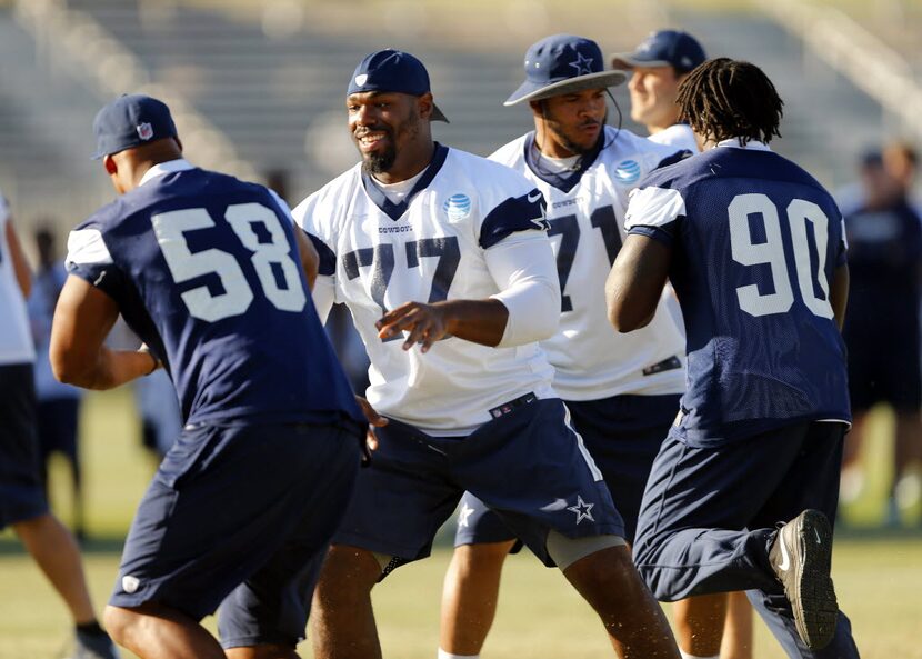 Dallas Cowboys tackle Tyron Smith (77) and offensive guard La'el Collins (71) block...