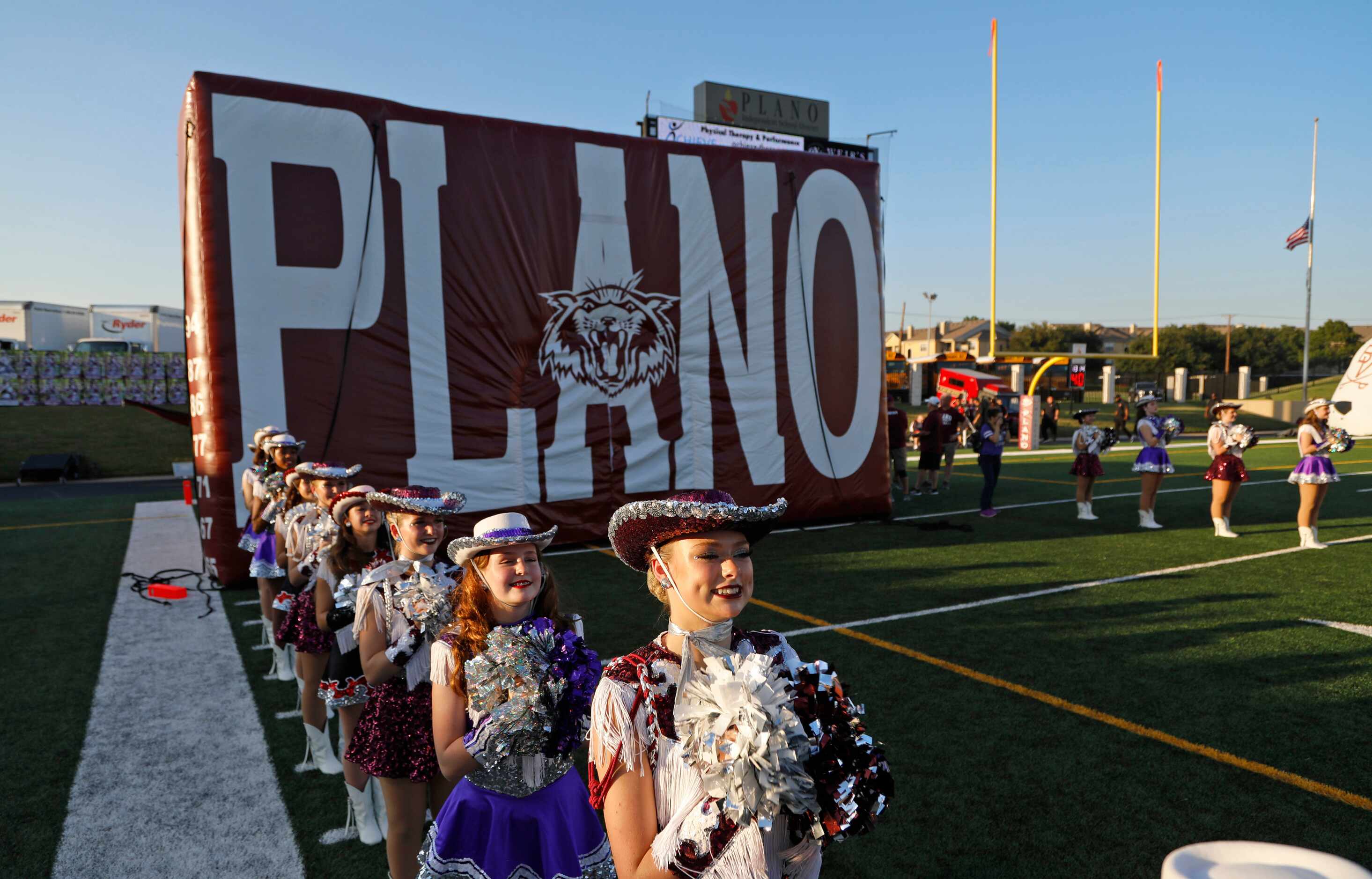 Planoette Peyton Bambach, 16, stands awaiting the Wildcats to take the field as Plano Senior...