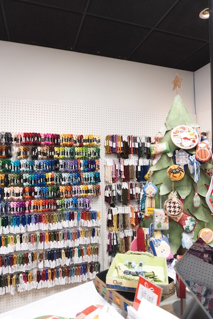 At Needlepoint This! on Lovers Lane, shoppers can brows walls of threads to choose fibers...