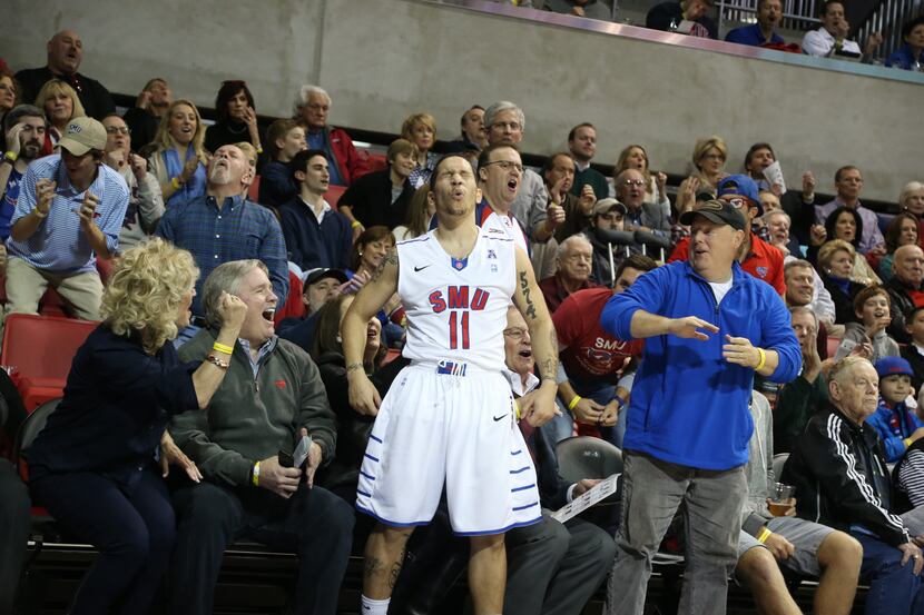 SMU Mustangs guard Nic Moore (11) reacts to missing a three pointer while being fouled by...