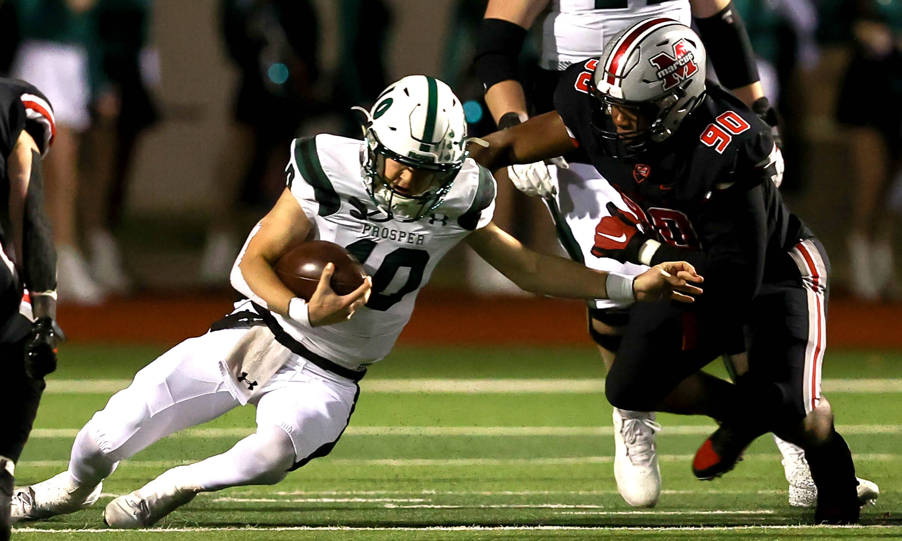 Flower Mound Marcus defensive lineman Bryson Barber (90) makes a sack on Prosper quarterback...