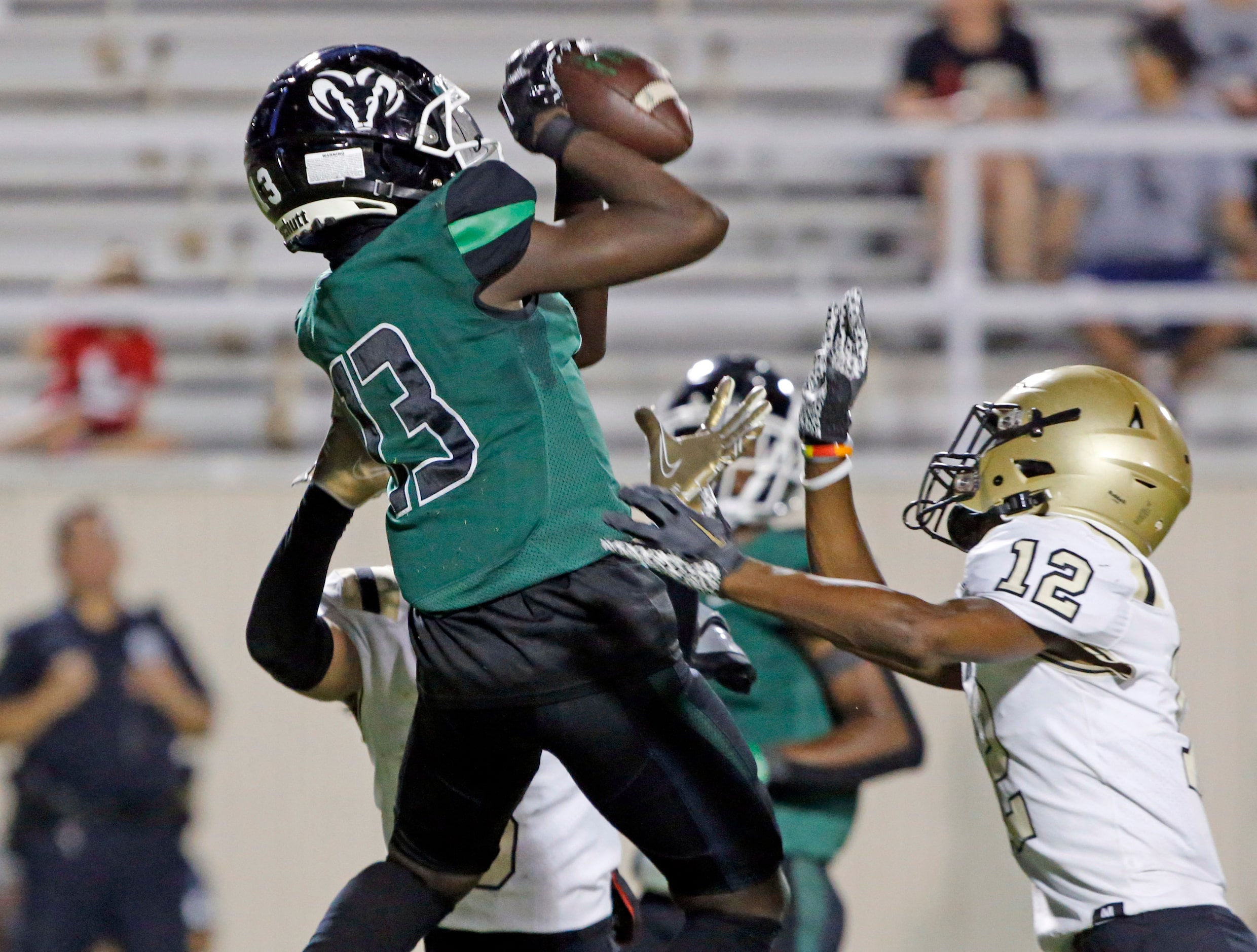 Richardson Berkner high’s Demarcus Calhoun (13) grabs a long pass for a first down during...