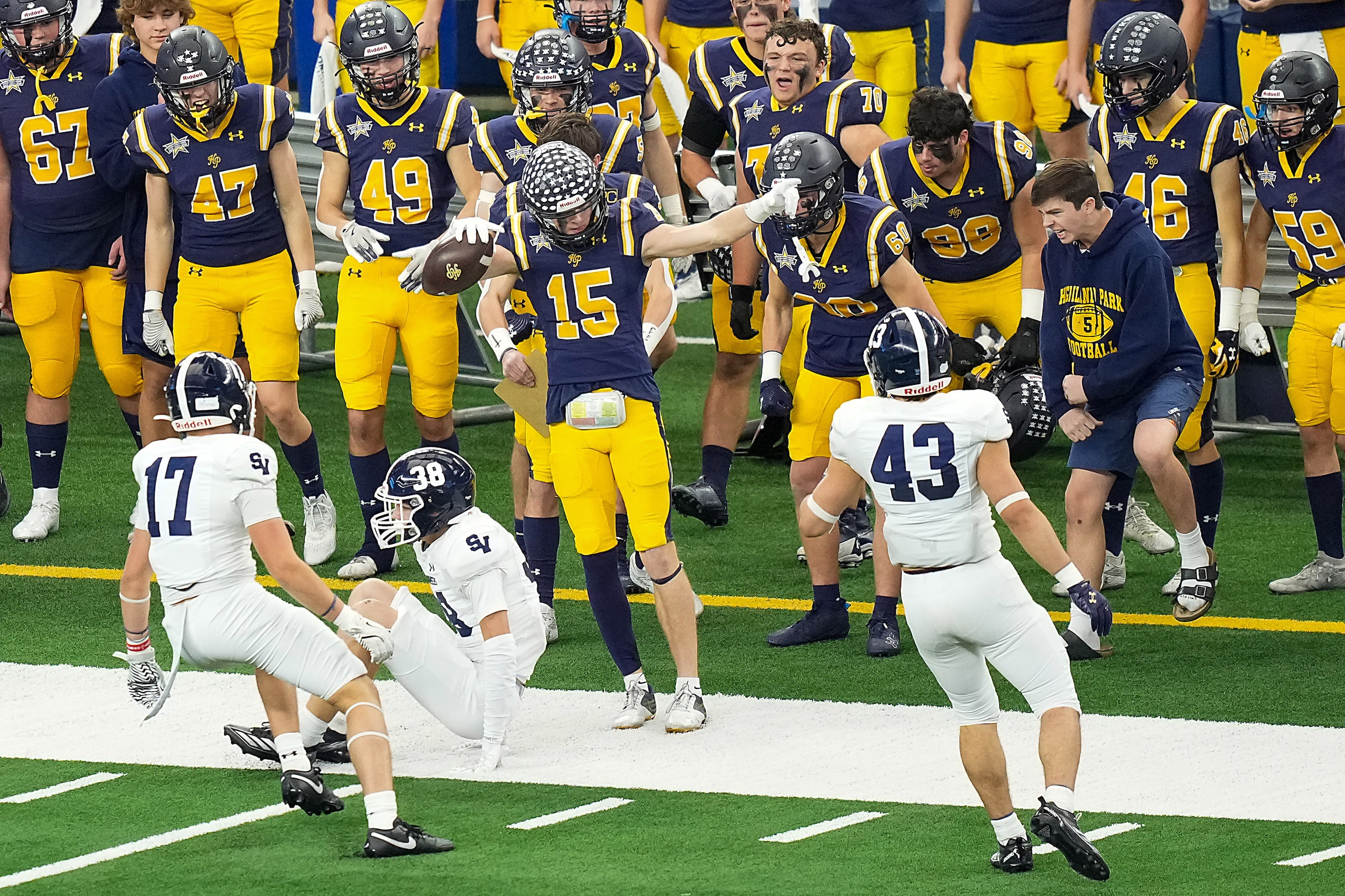 Highland Park's Benton Owens (15) celebrates after picking up a first down during the first...