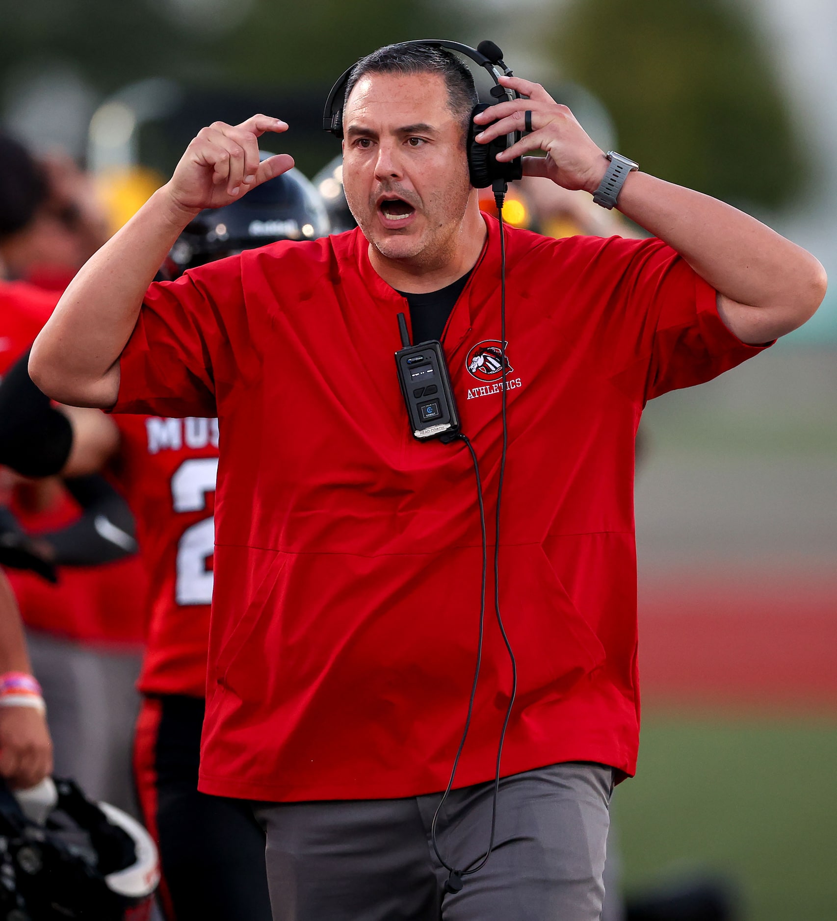 Creekview head coach Dusty Ortiz reacts to a call against W.T. White during the first half...