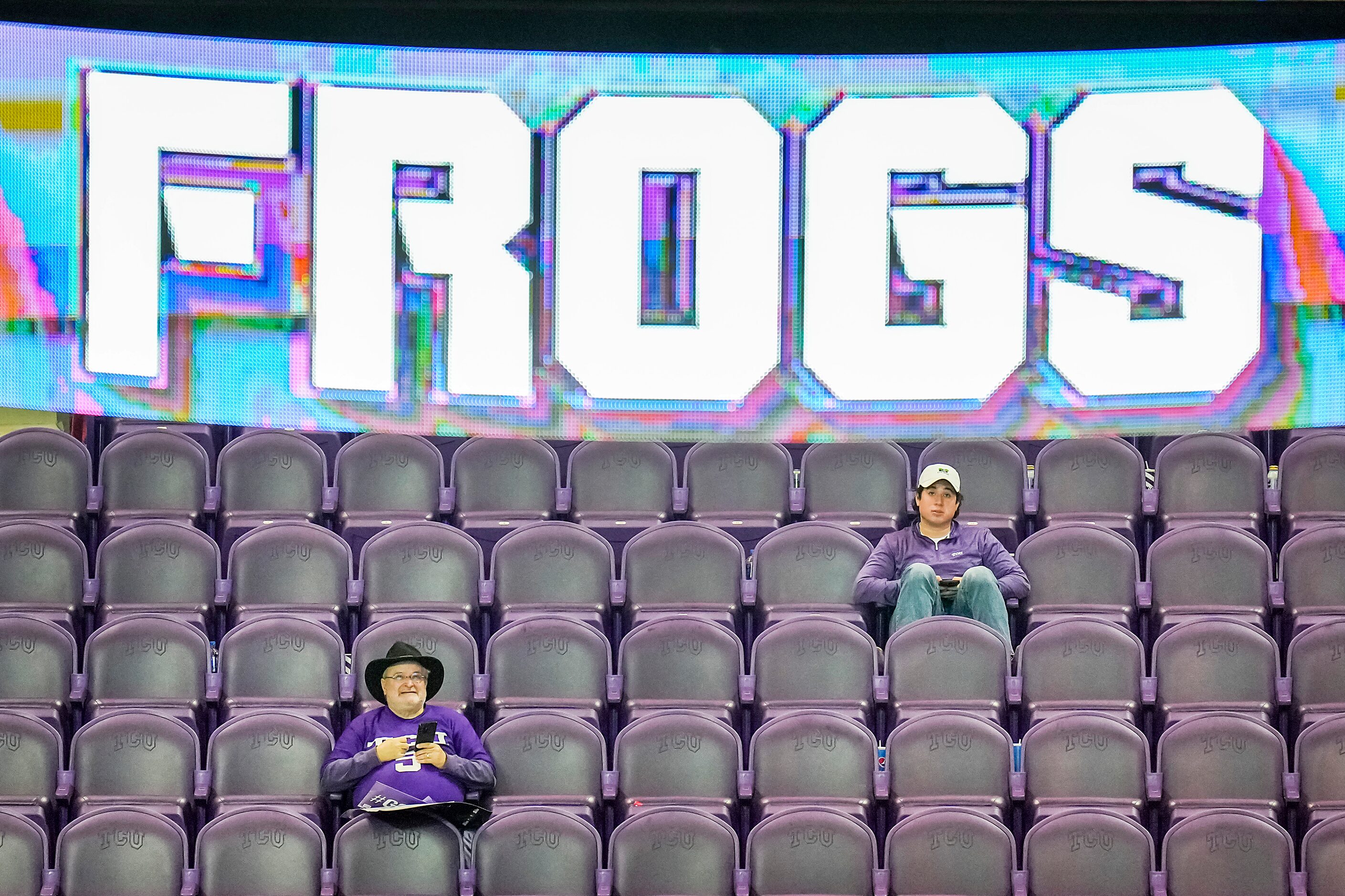 TCU fans Bruce Payne (left) and Sebastian Mesa watch the fourth quarter of a loss to Georgia...