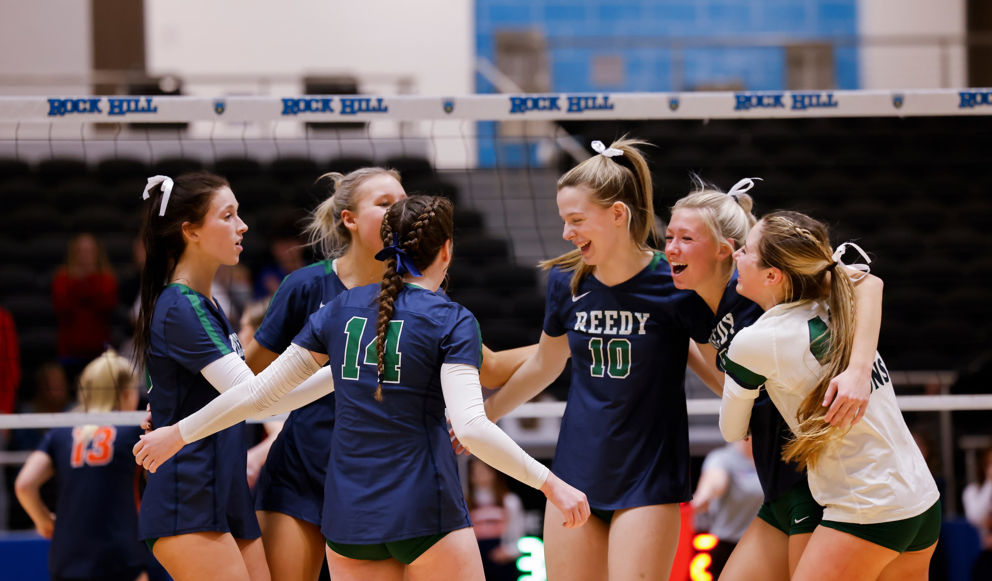 Frisco Reedy celebrate gaining a point against Frisco Wakeland during the second set of a...