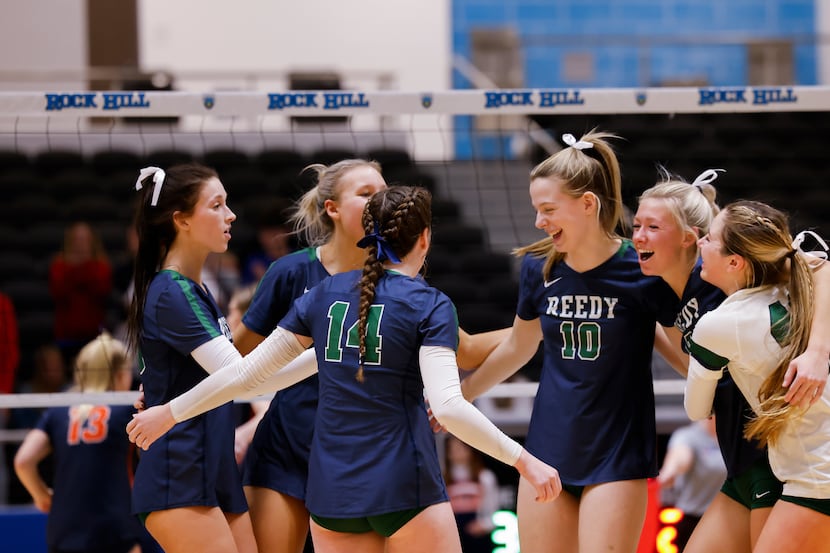 Frisco Reedy celebrate gaining a point against Frisco Wakeland during the second set of a...