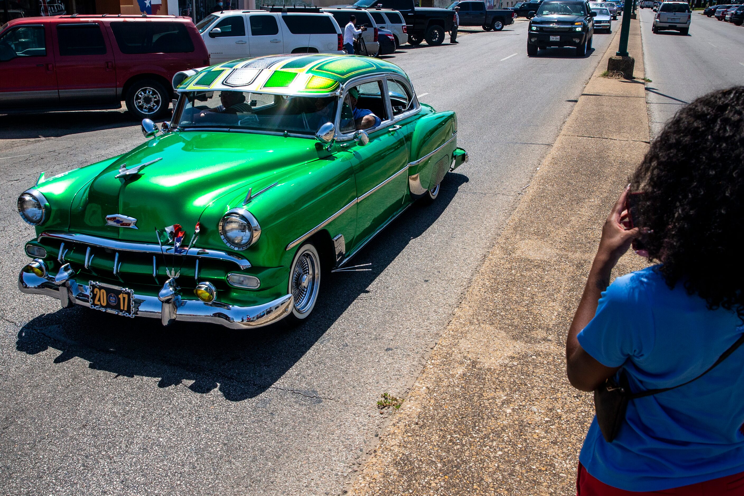 The United Lowriders Association of Dallas drive along the Jefferson Boulevard business...