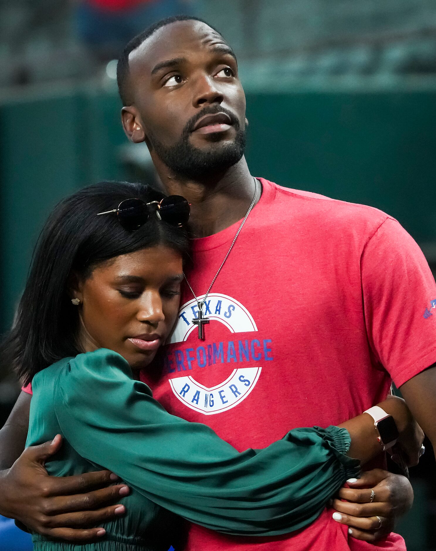 Texas Rangers pitcher Taylor Hearn hugs his sister Robyn before the team’s home opener...