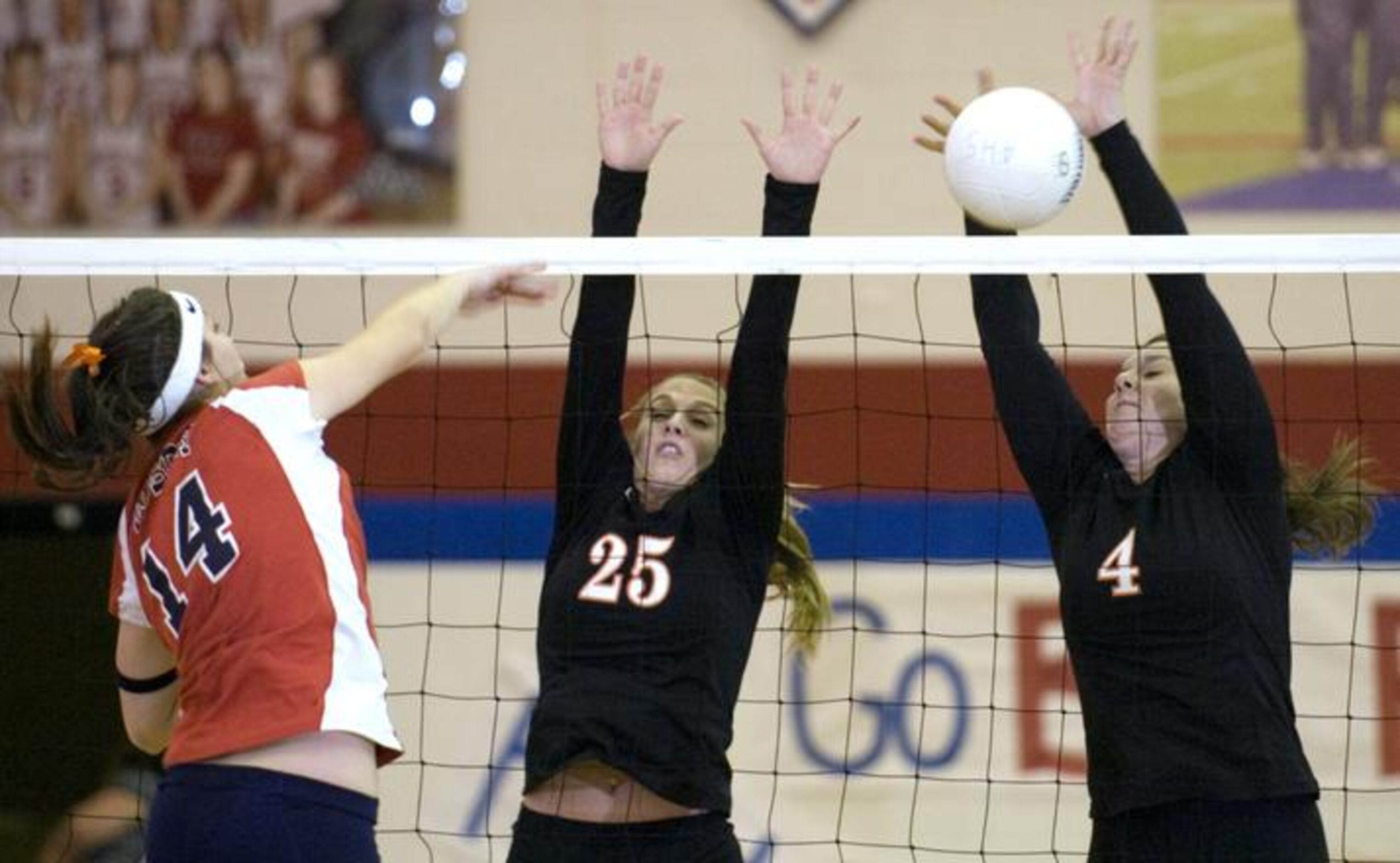 Aubrey's Jac Bullock (14) tries to hit the ball past Pilot Point's Rachel Fritz (25) and...