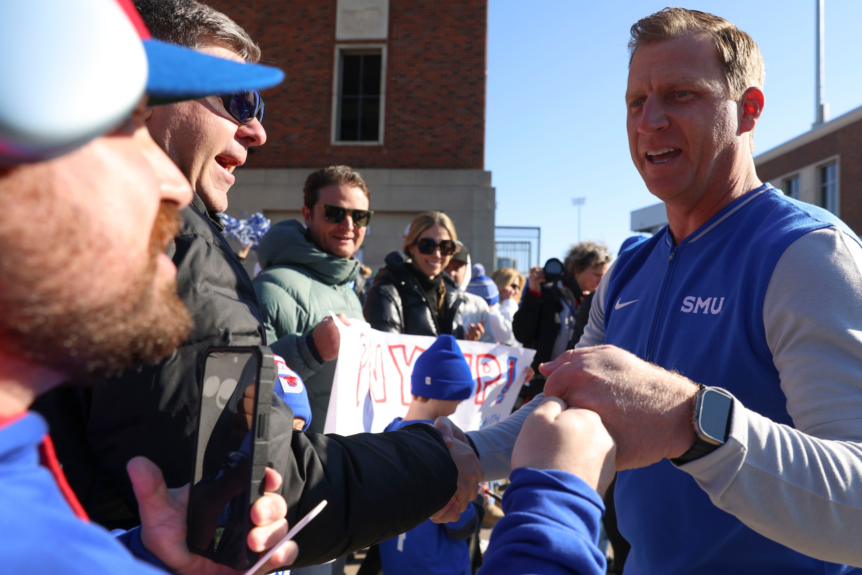 SMU head coach Rhett Lashlee greets the fans during a send-off party for the football team...