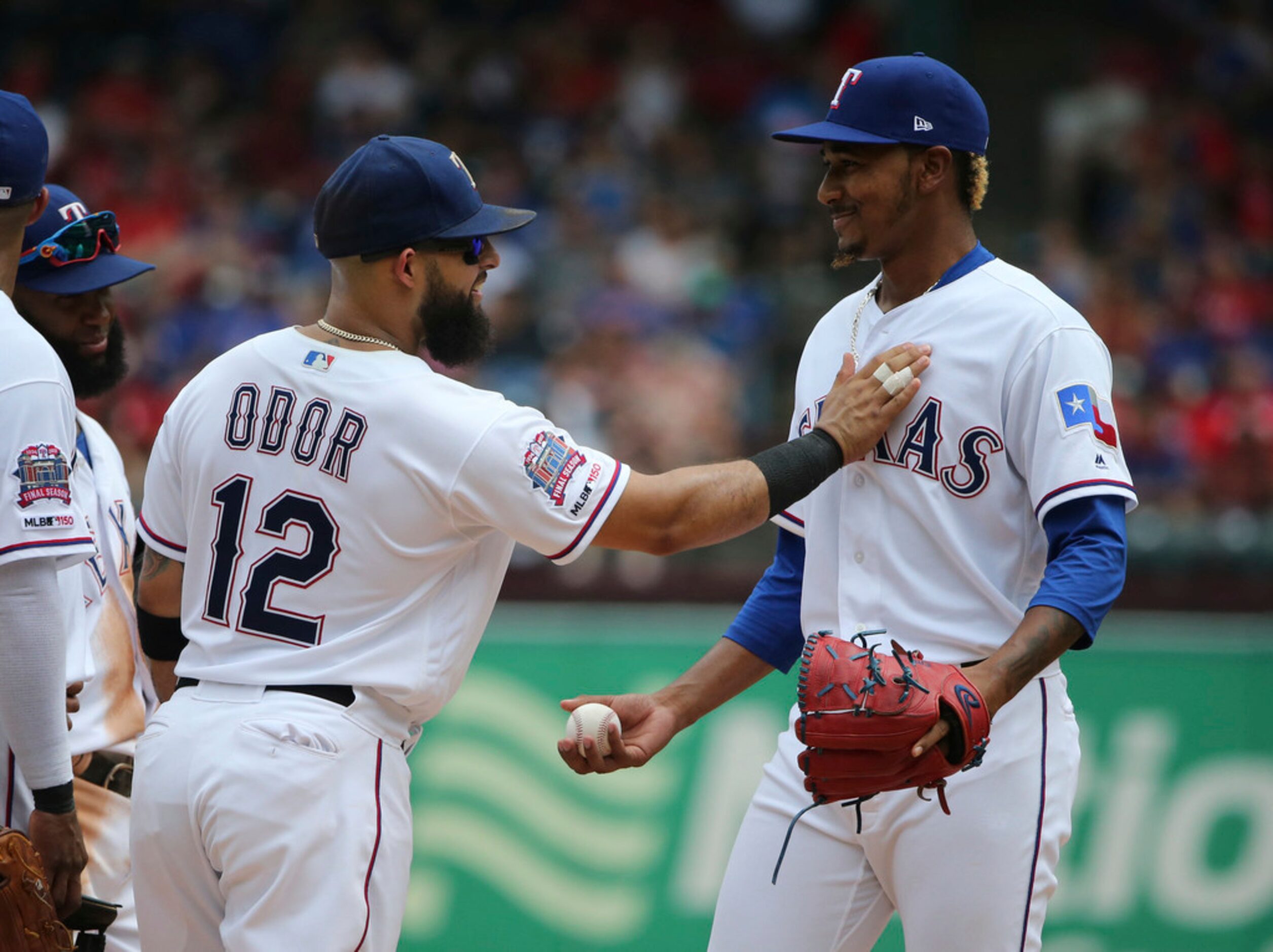 Texas Rangers second baseman Rougned Odor (12) encourages Texas Rangers relief pitcher...