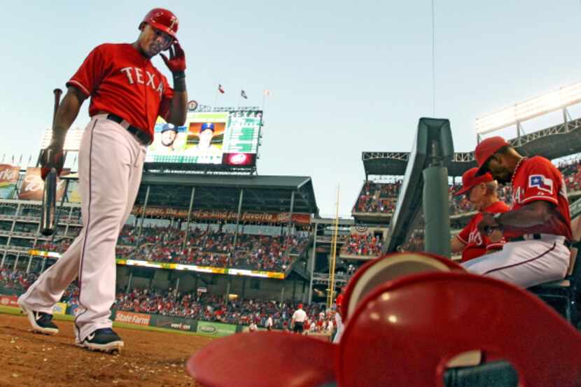 Texas Rangers right fielder Nelson Cruz (left) and second baseman Esteban German celebrate...
