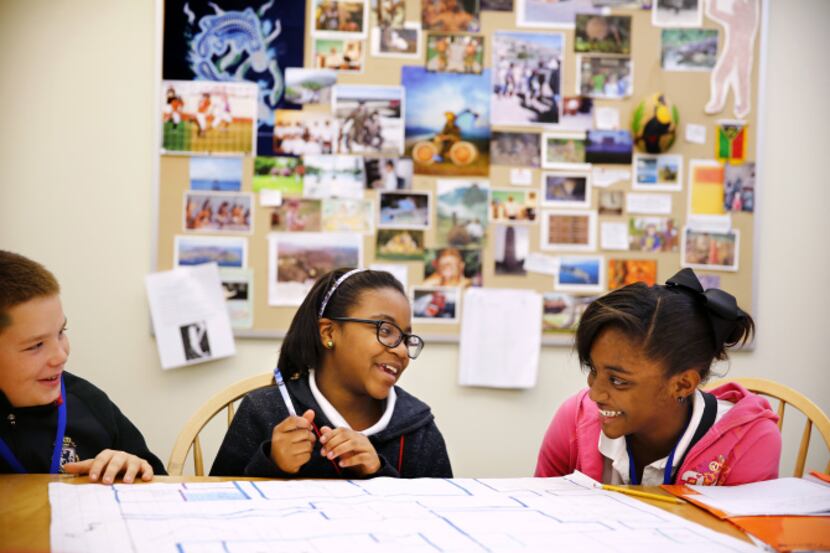 Sixth-grade math students (from left) Caleb Smith, Kendacia Combs and Tiavionne Brazile...