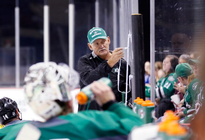 Dallas Stars Head Coach Lindy Ruff, center, gives players a direction during the first day...