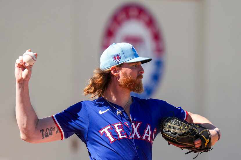 Texas Rangers pitcher Jon Gray throws in the bullpen during a spring training workout at the...