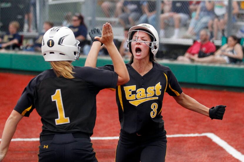 Plano East's Ronni Ramos (#1) congratulates Amy Jensen (#3) after Jensen scored the tying...