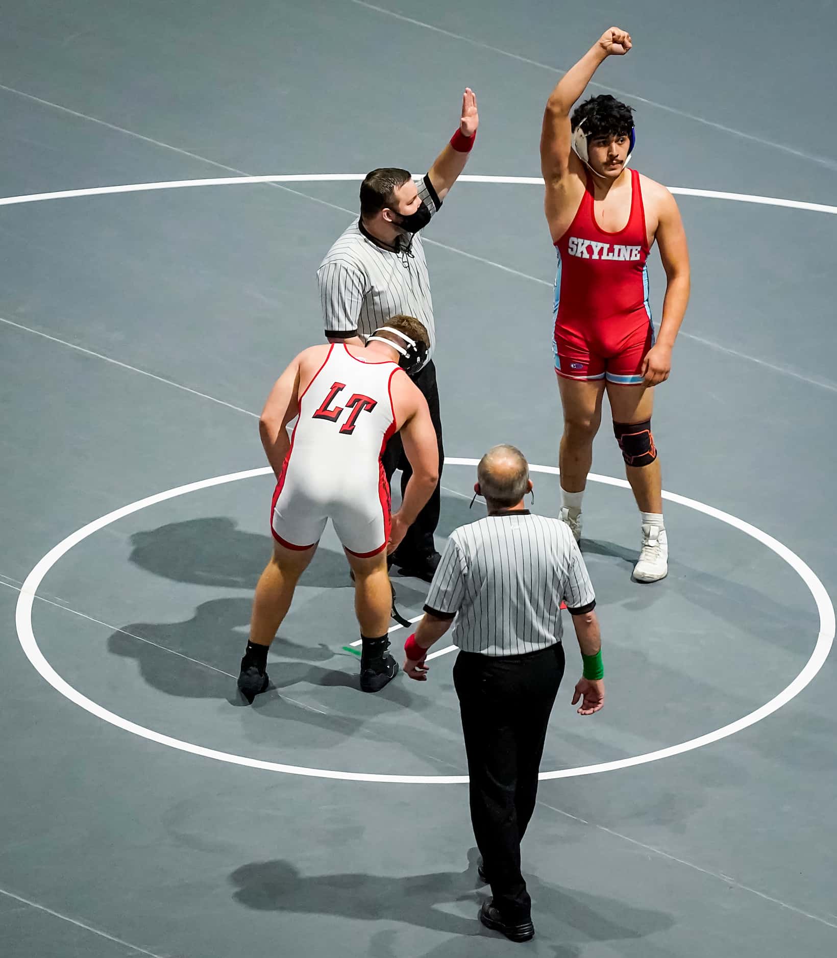 Christian Mendez of Dallas Skyline celebrates after defeating Isaac Slade of Austin Lake...