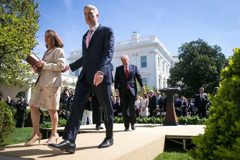 Supreme Court Justice Neil Gorsuch and his wife, Marie Louise Gorsuch, depart after his...