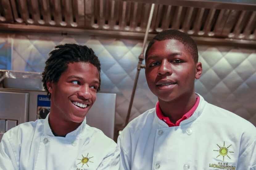 Adolph Martin (left) and Malik Runnels are interns at Cafe Momentum, one of  two new...
