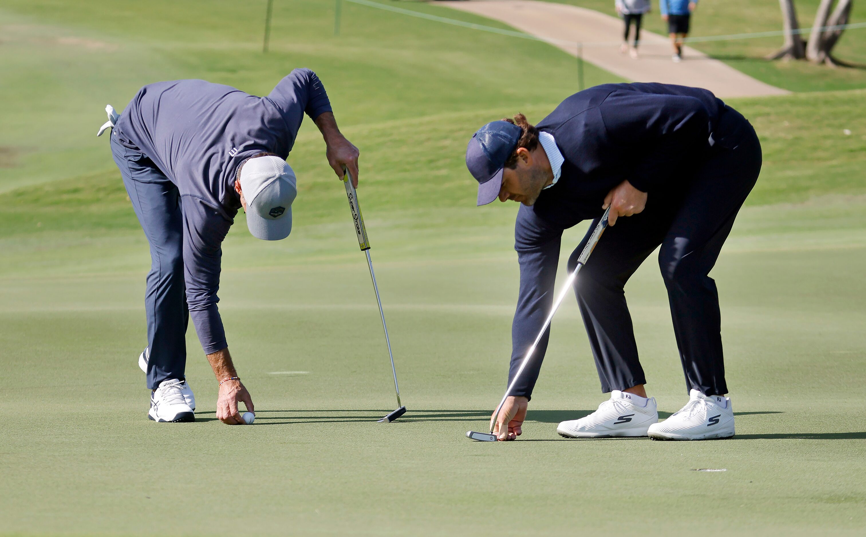 Former Dallas Cowboys quarterback Tony Romo (right) and former Dallas Stars player Mike...