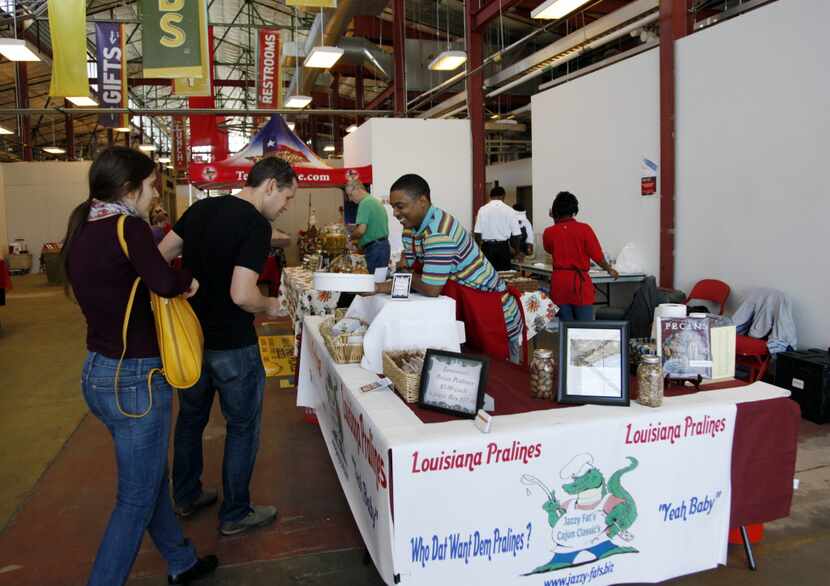 Patrons sample the pralines at the Louisiana Praline stand at the City of Dallas Farmers...