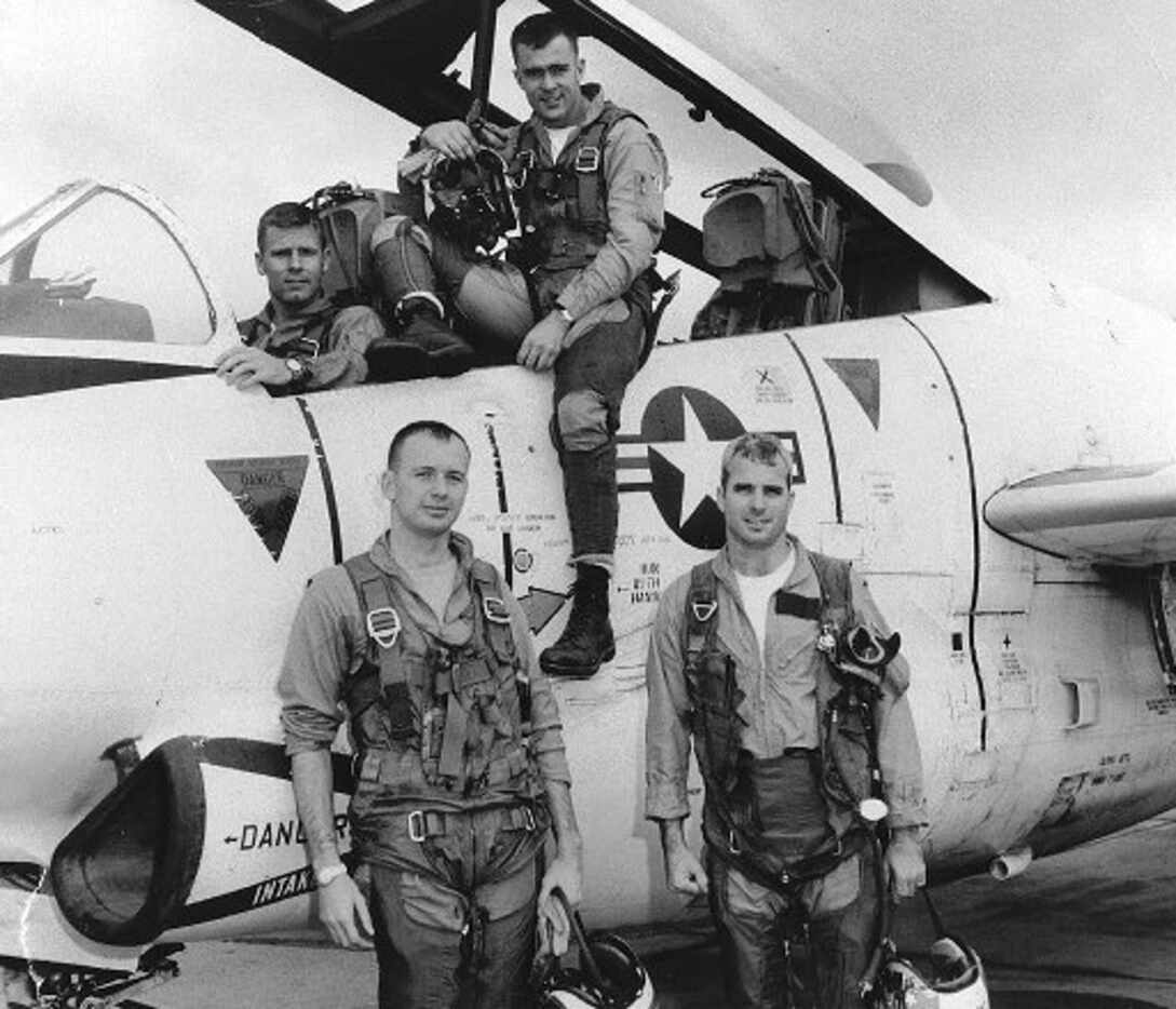 John McCain (right) posed with his squadron in a photo from 1965. 