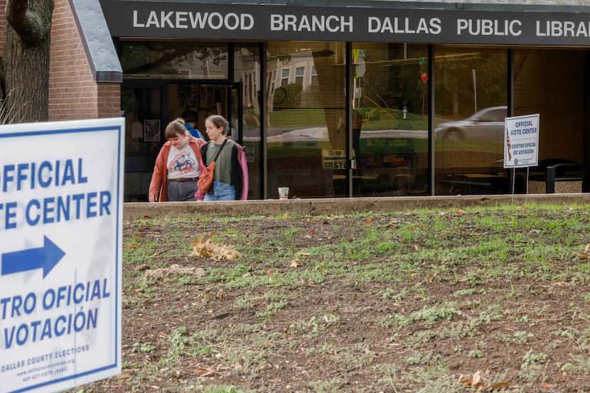 Voters leave after casting their ballot on Election Day at the Lakewood Branch Library in...