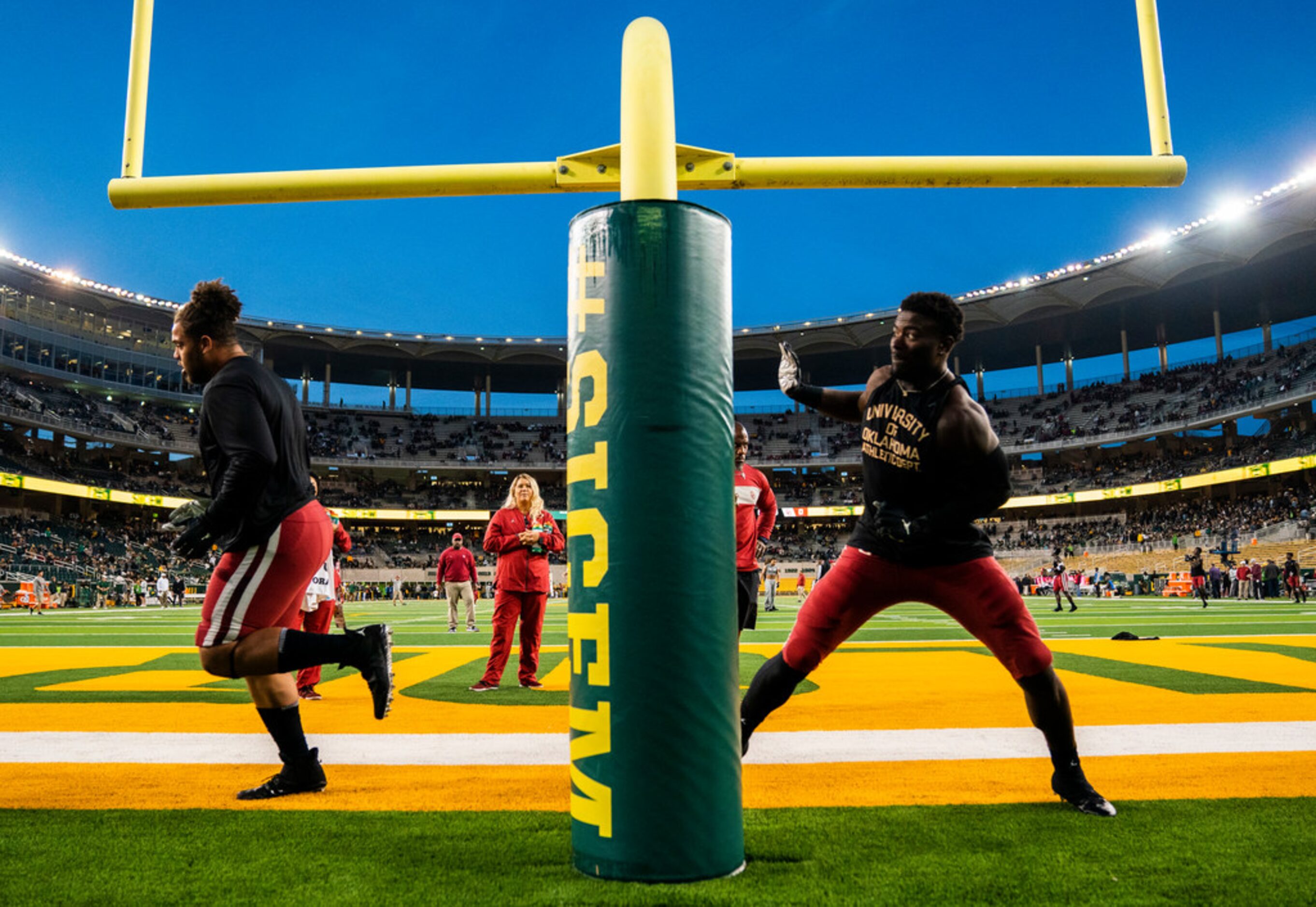 Oklahoma Sooners defensive players warm up before an NCAA football game between Baylor...