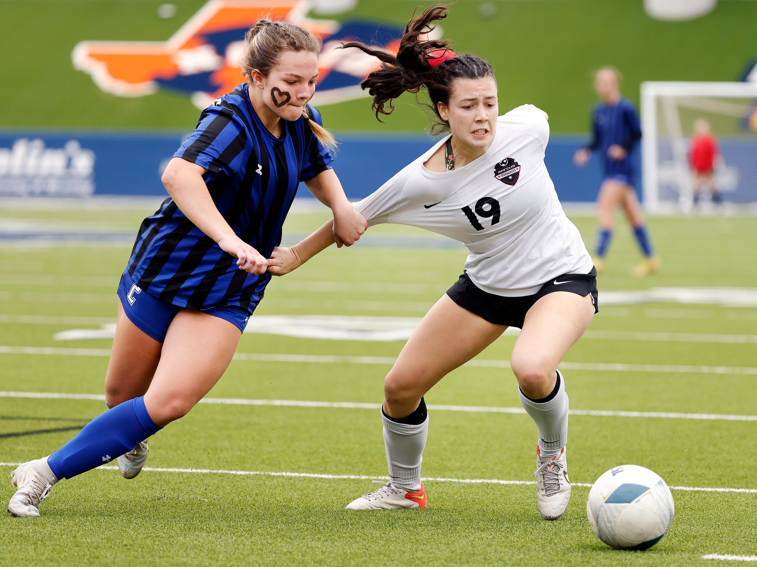 Trophy Club Byron Nelson midfielder Presley Whitmire (2) pulls on Flower Mound Marcus...