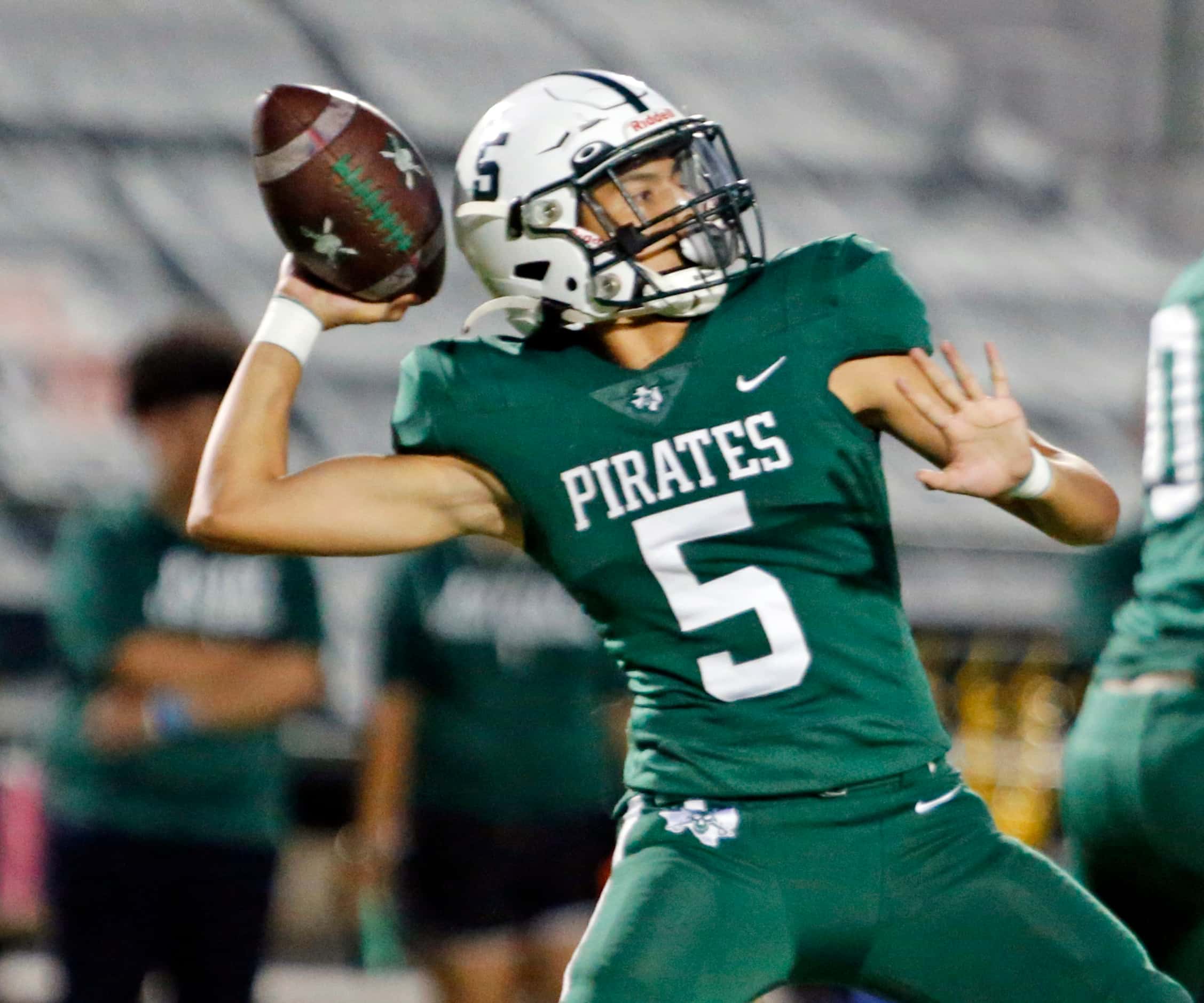 Mesquite Poteet high QB (5) throws a pass during the first half of a high school football...