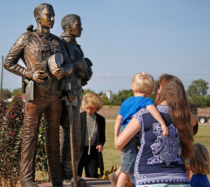 
Both young and old take a look at the new Heroes of Wylie bronze sculpture, created by...