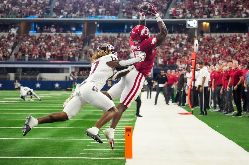 Arkansas wide receiver Treylon Burks (16) can’t come down in bounds on a pass near the goal...