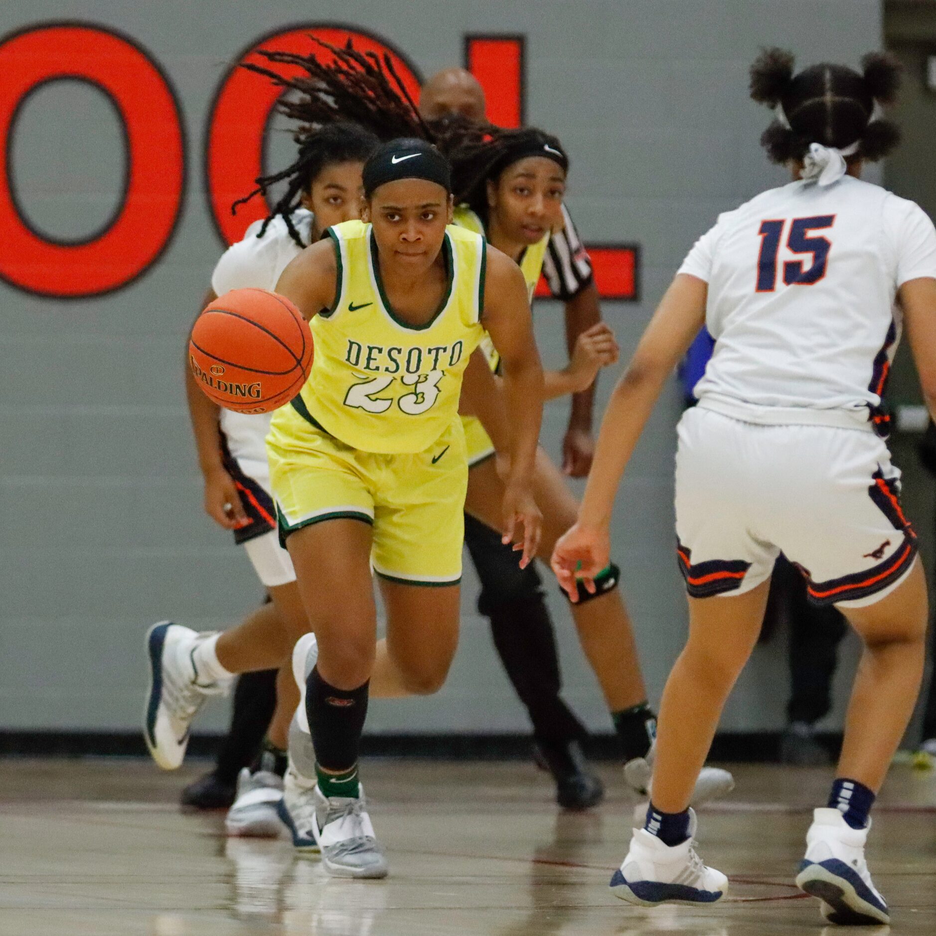 DeSoto’s Kendall Brown (23) pushes the ball past Sachse’s Londyn Oliphant (15) during the...