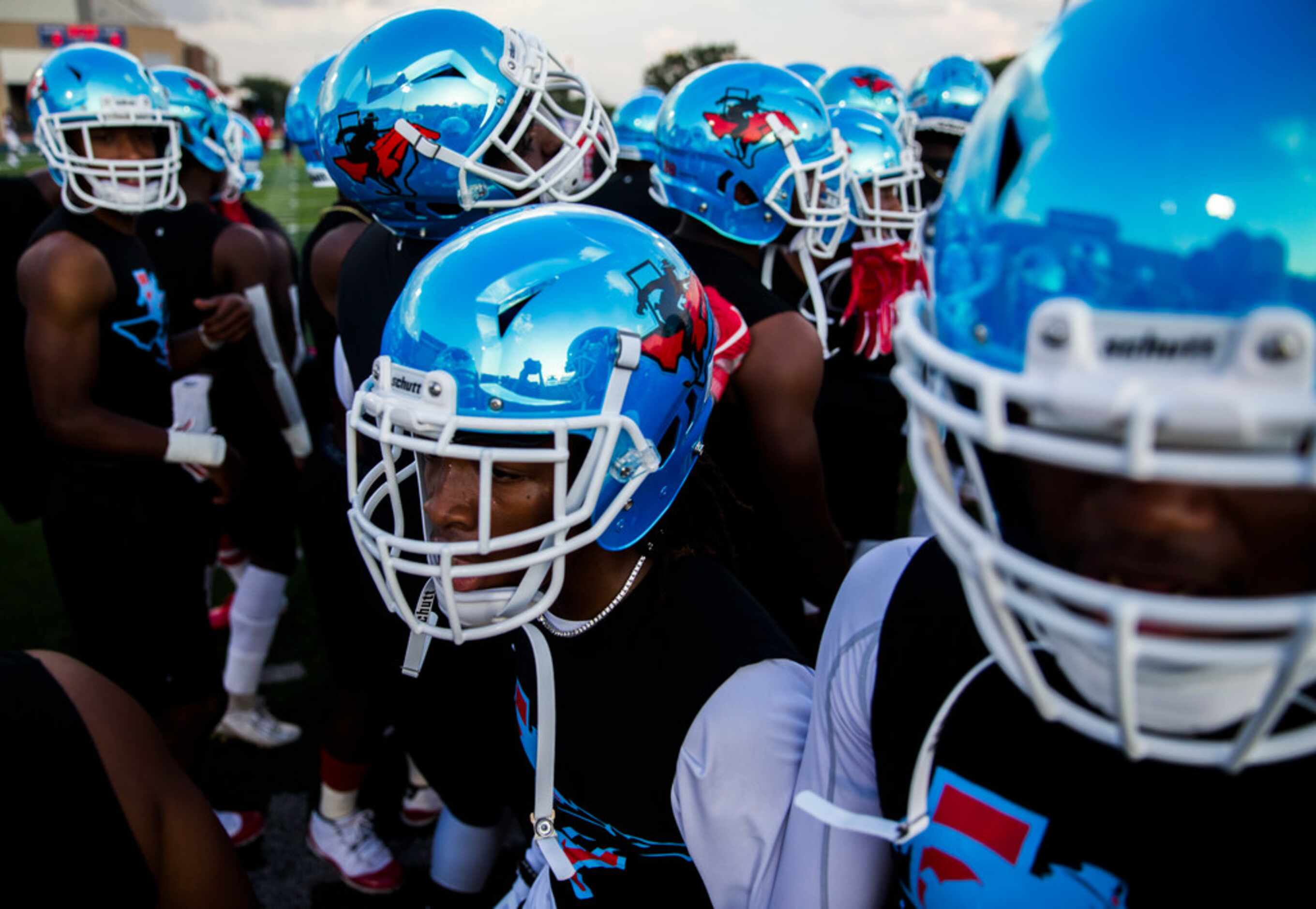 Skyline football players get hyped up before a high school football game between Skyline and...