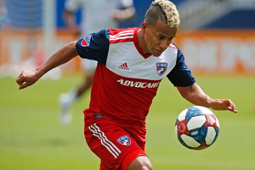 FC Dallas midfielder Michael Barrios (21) chases down a pass during the first half as FC...