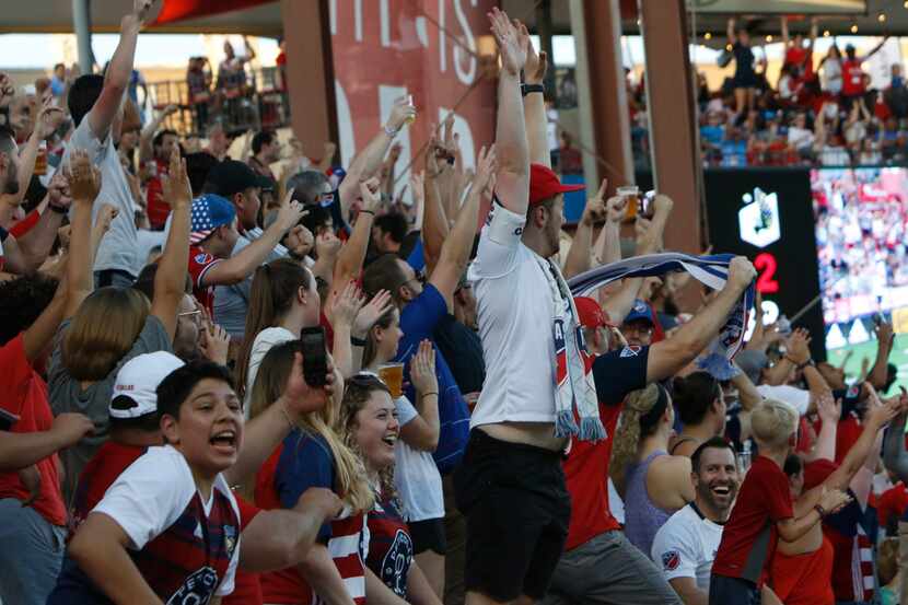 FC Dallas fans react as they celebrate the tie breaking goal by defenseman Reggie Cannon (2)...