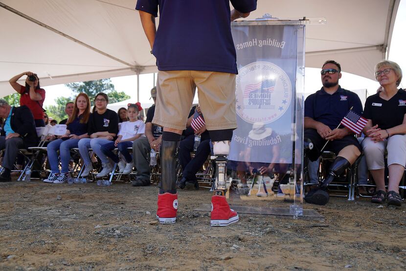 Marine Corps Sgt. Omar Milan, a single amputee, spoke to well-wishers and supporters during...