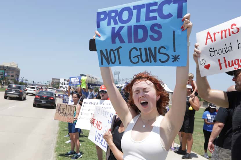 Maddie Worby joins students and community members in a protest against mass shootings during...