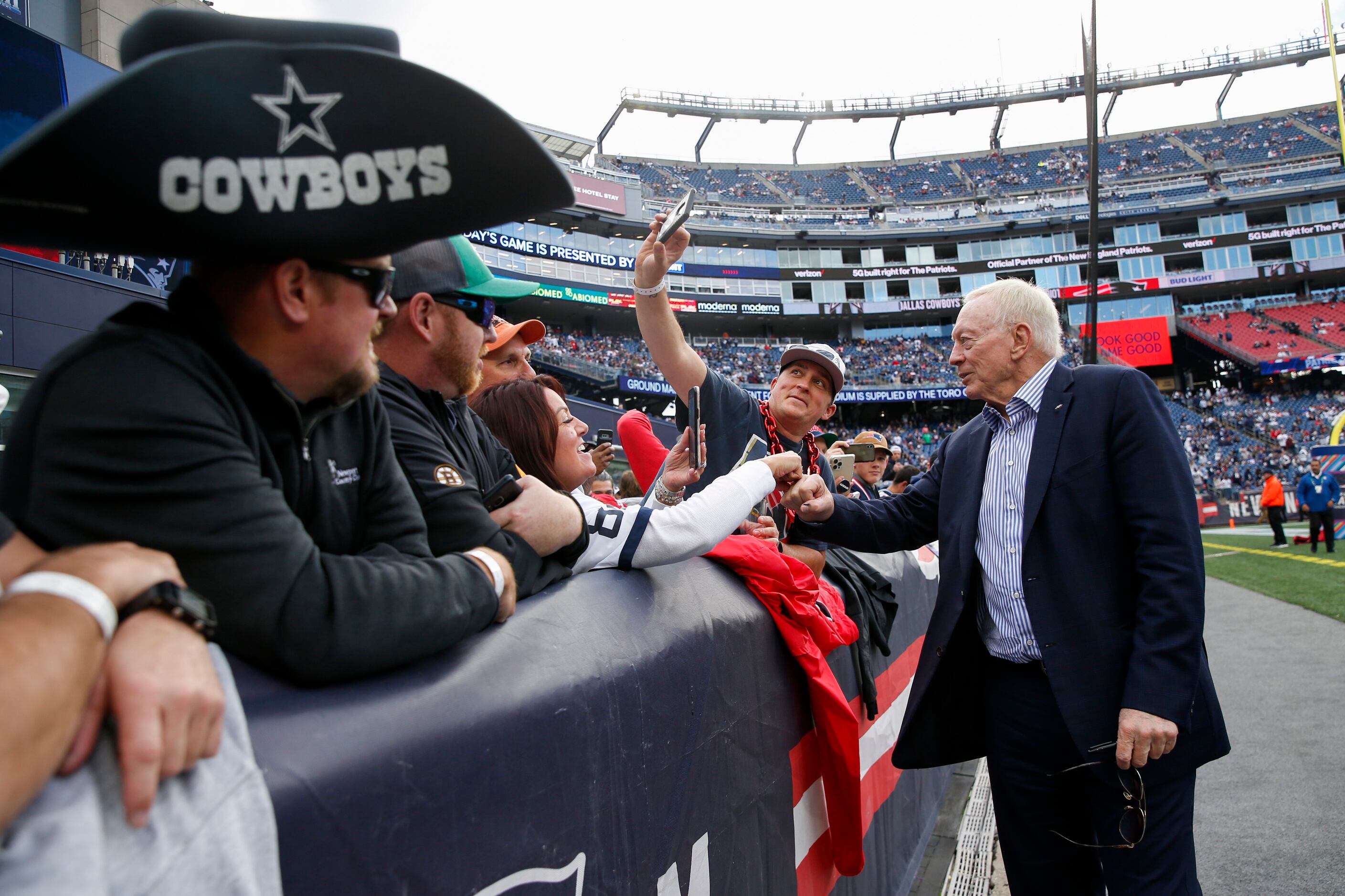 Dallas Cowboys owner Jerry Jones (right) takes a selfie before the start of a NFL game...