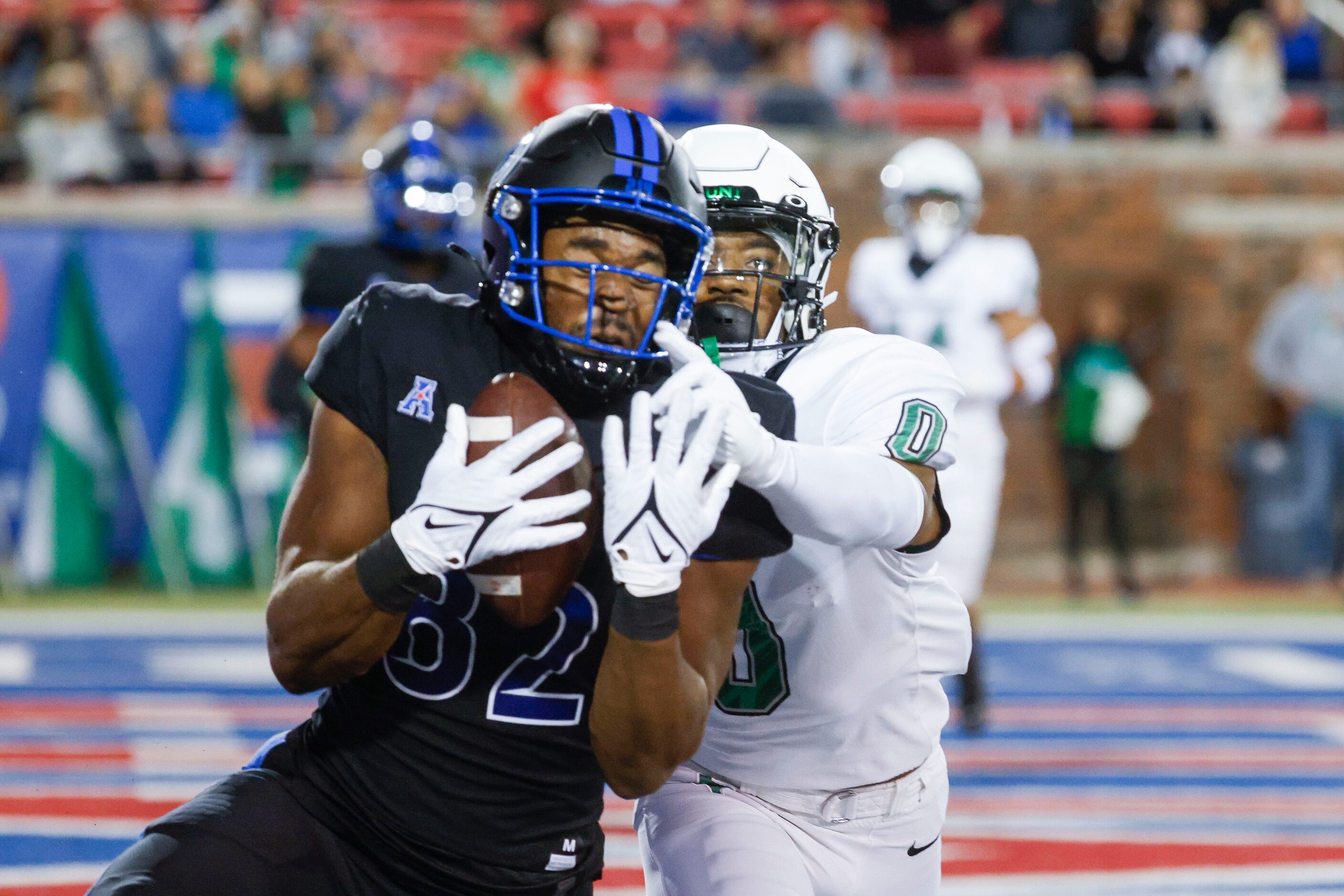 Southern Methodist Mustangs wide receiver Joey Bruszer (left) scores a touchdown past North...