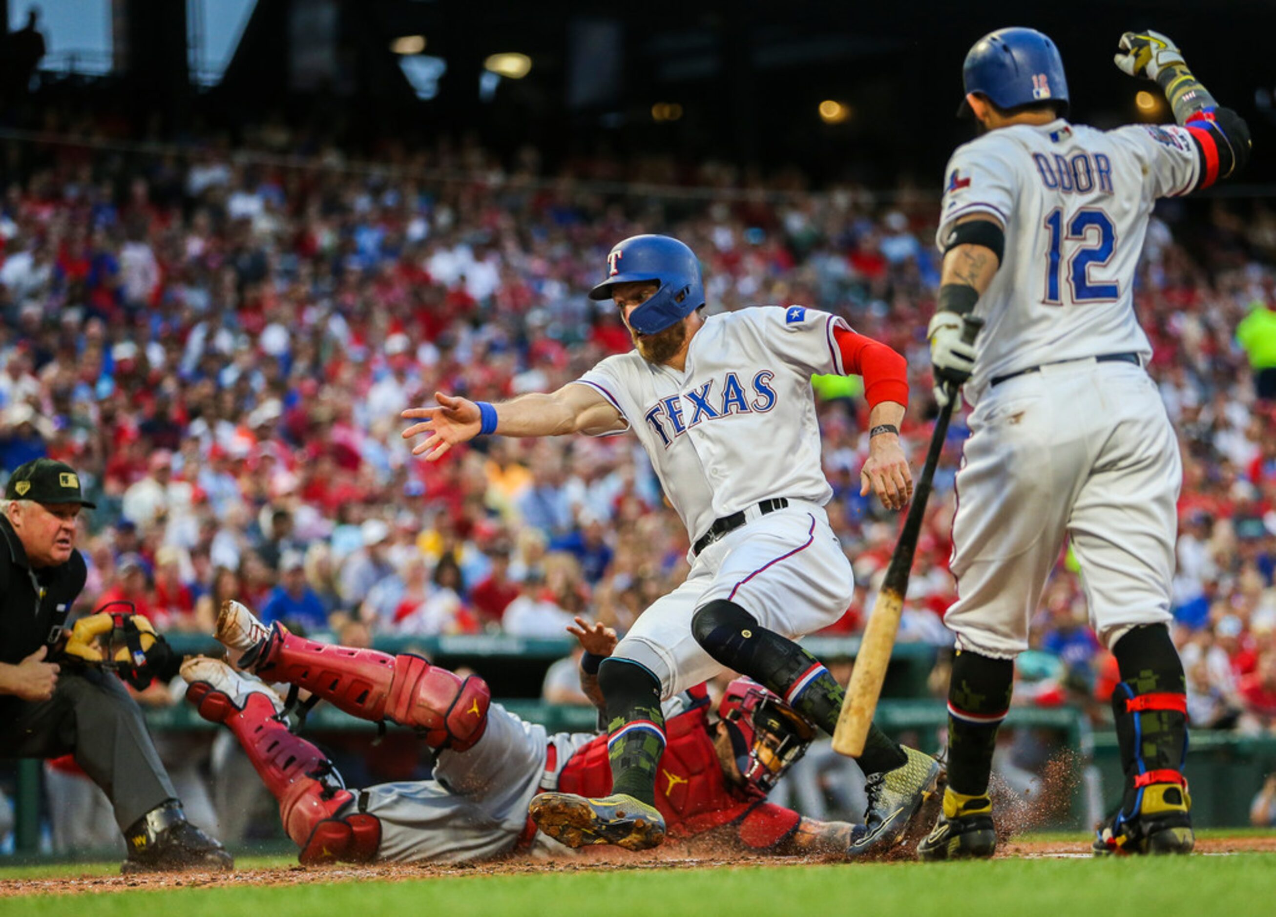 St. Louis Cardinals catcher Yadier Molina (4) tags out Texas Rangers designated hitter...