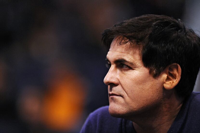 Dallas Mavericks owner Mark Cuban watches the game from the sidelines against the Phoenix...