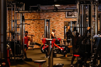 Customers work out at the new Gold's Gym Highland Meadows in Dallas on Friday.