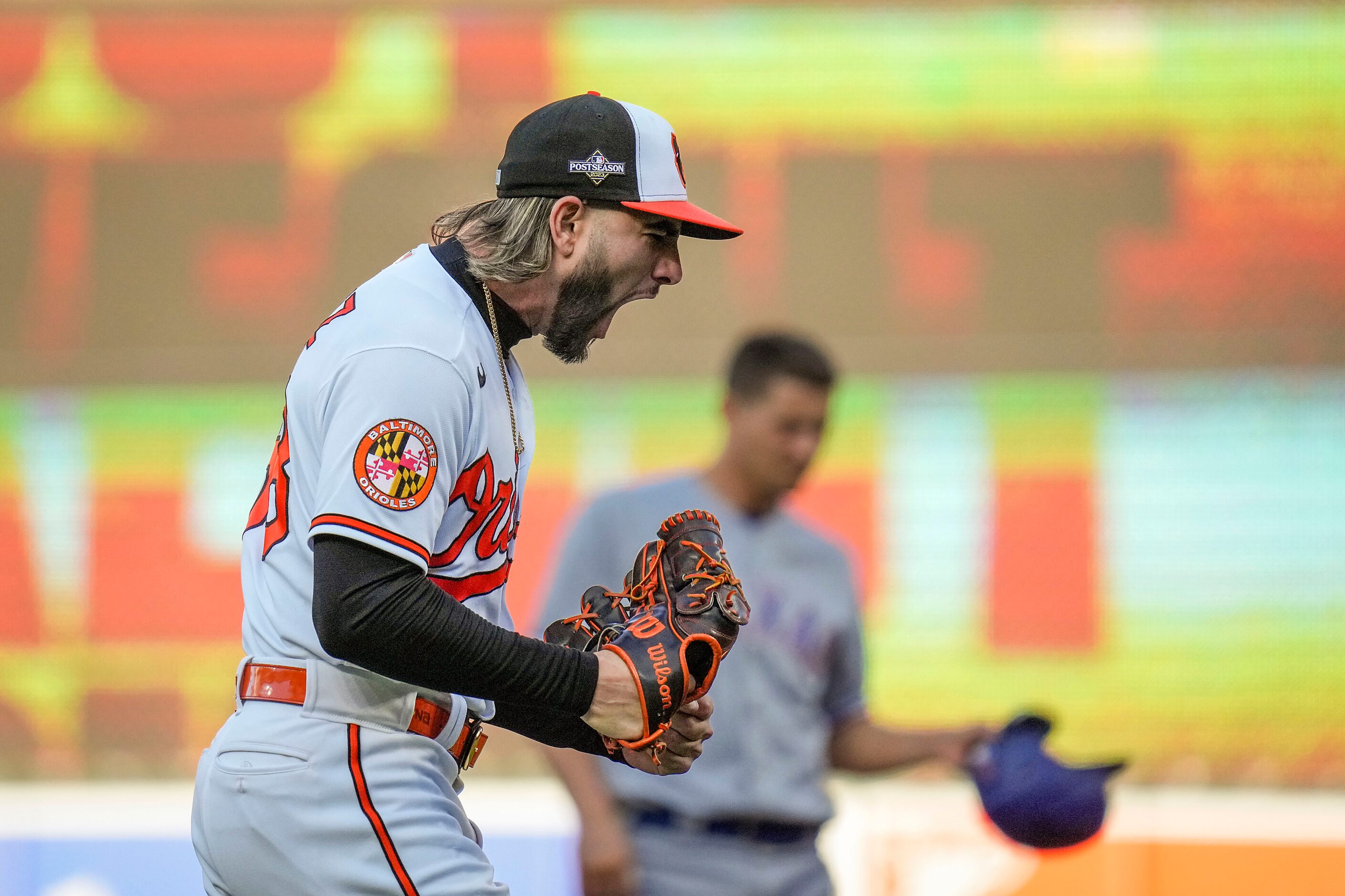 Baltimore Orioles relief pitcher Cionel Perez reacts after striking out Texas Rangers right...